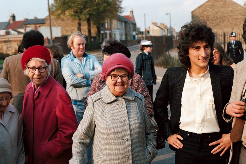 A photo taken in the 1980s of Francis Gomila with members of the Millfield community.