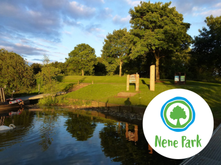 showing some of the lake and park at Nene Park Trust. Trees in the background. Nene Park Trust log on the bottom right. 