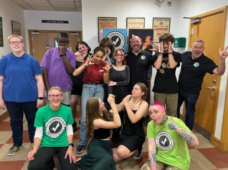A group photo of 8 young people and 4 adults. They are all pulling varying silly faces, expressing the sense of fun that this project has given them.